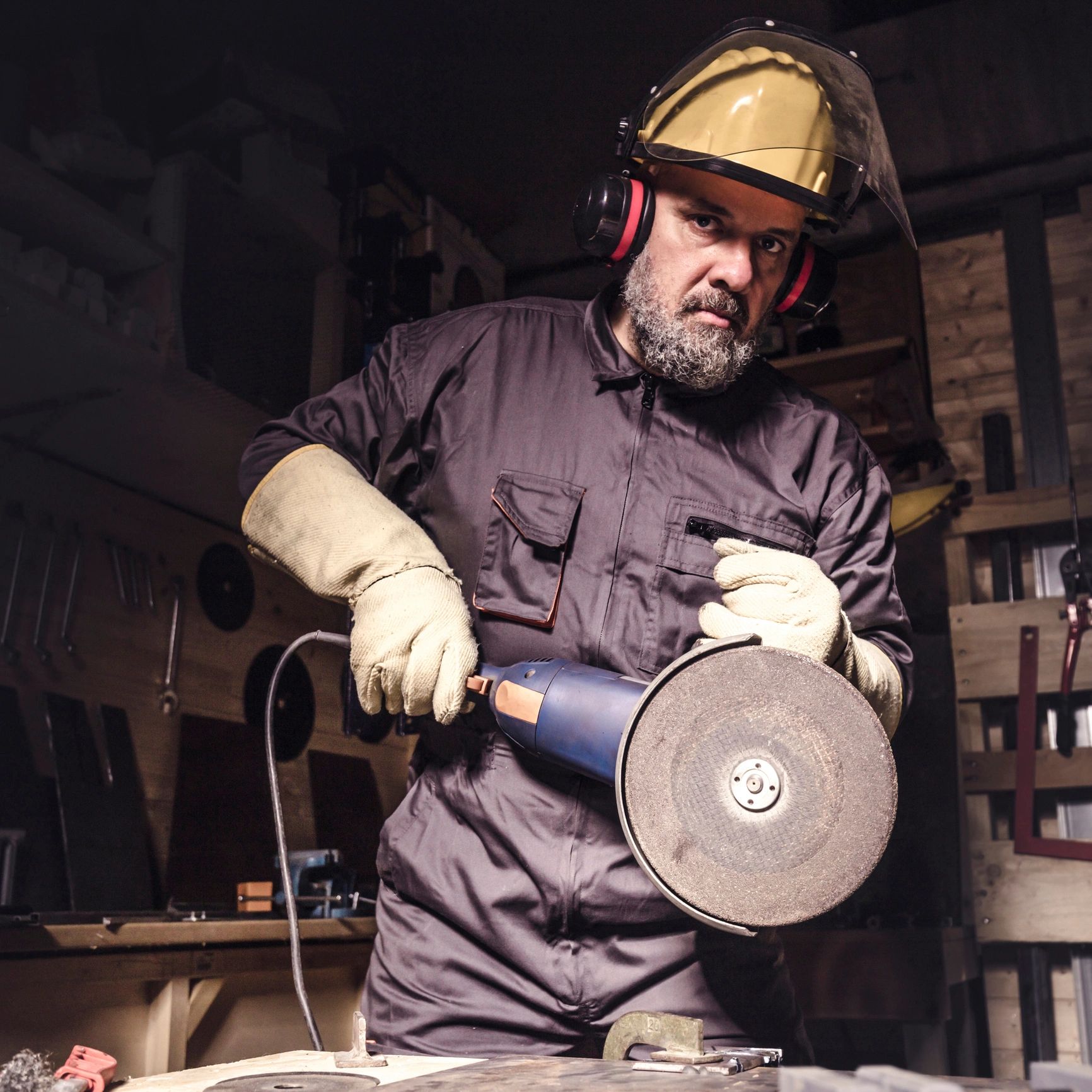 Manual worker portrait in automotive workshop