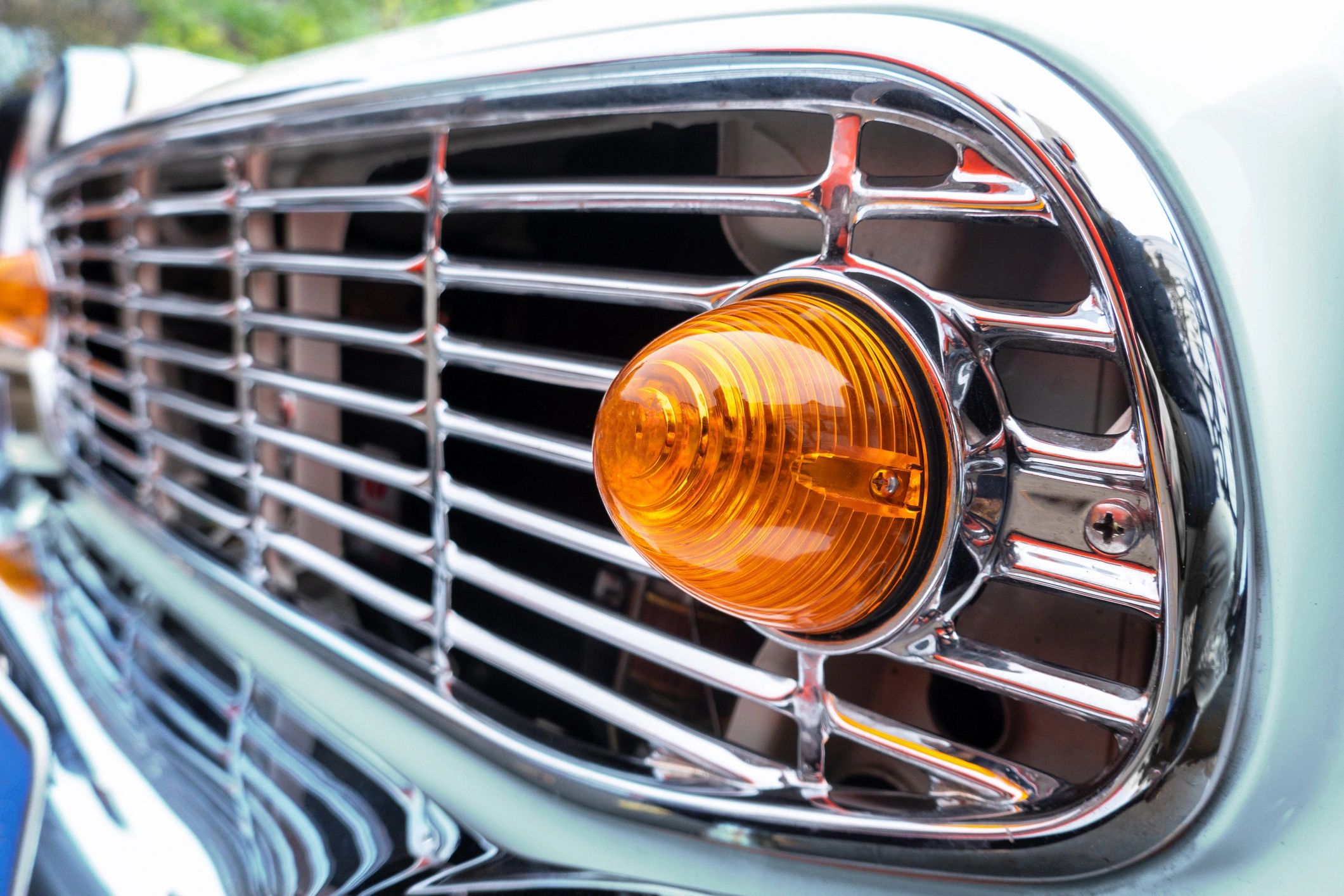 Classic car grille detail showing restored trim