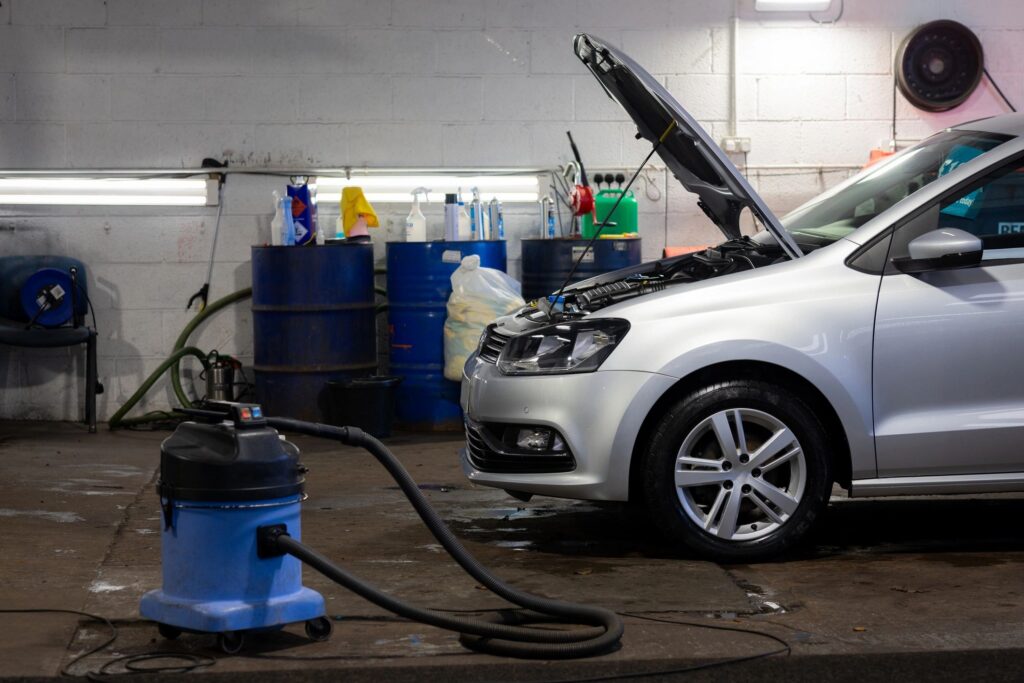 Automotive workshop interior with vehicle being serviced