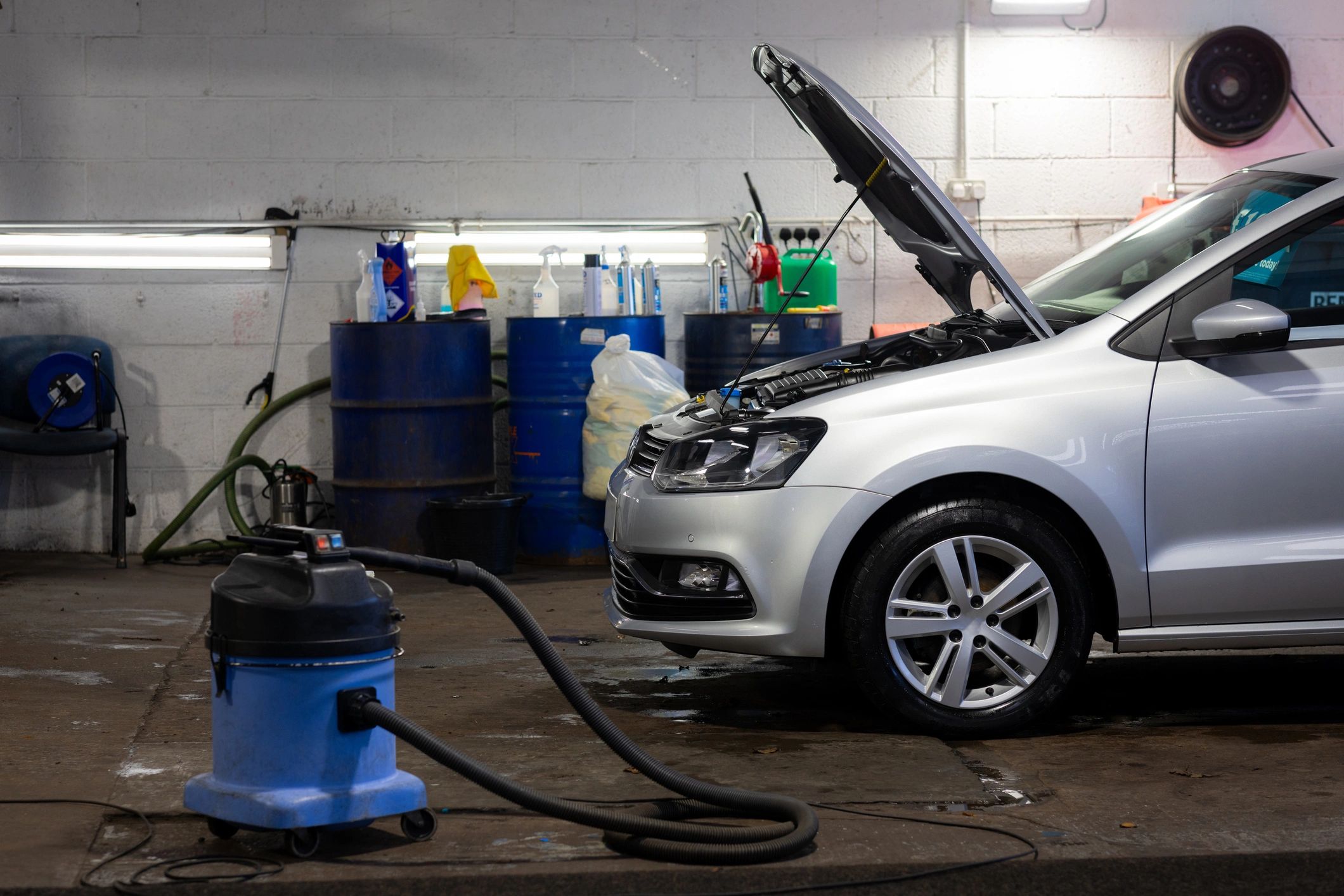 Car being serviced inside a professional workshop